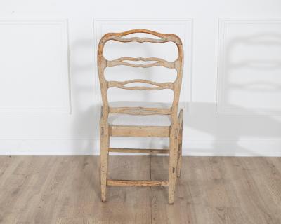 A set of four period Gustavian chairs scraped to original paint and newly covere