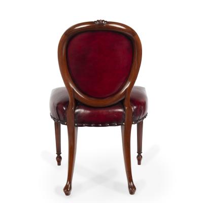 A set of ten Victorian mahogany dining chairs in the style of Hepplewhite