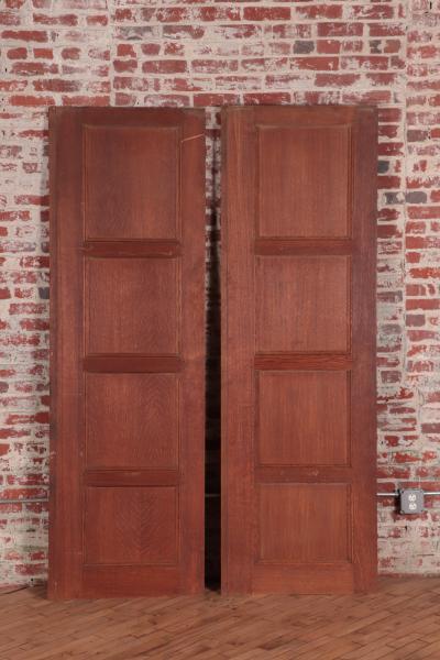 A set of two oak doors with eight panels each Circa 1900