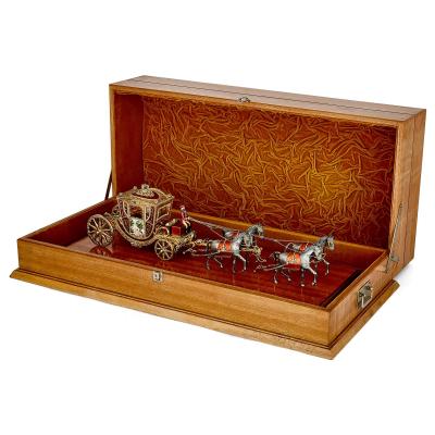 A silver gilt and enamel Austro Hungarian horse drawn carriage model