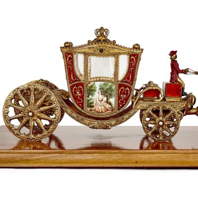 A silver gilt and enamel Austro Hungarian horse drawn carriage model