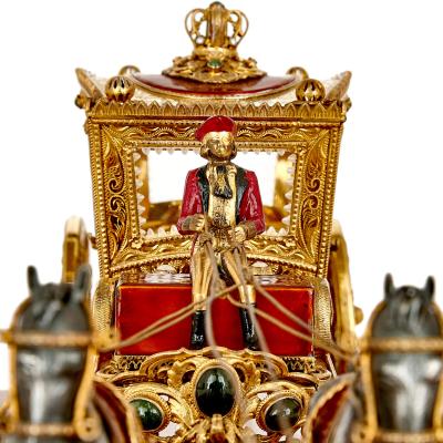 A silver gilt and enamel Austro Hungarian horse drawn carriage model