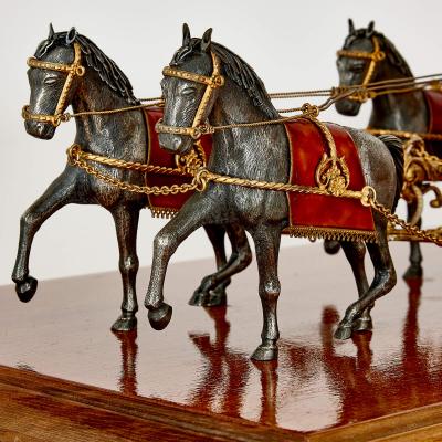 A silver gilt and enamel Austro Hungarian horse drawn carriage model