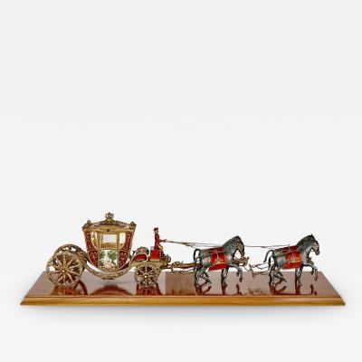 A silver gilt and enamel Austro Hungarian horse drawn carriage model