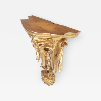 A small French gilt and carved wood wall mounted shelf circa 1880 
