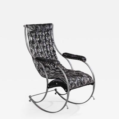 A steel and leather rocking chair in the manner of R W Winfield