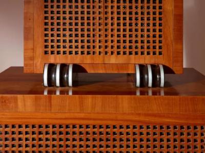 A two part cabinet in rare exotic woods with solid ebony inlays Italy 1990s