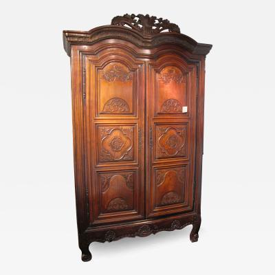 A very decorative and unusual walnut armoire