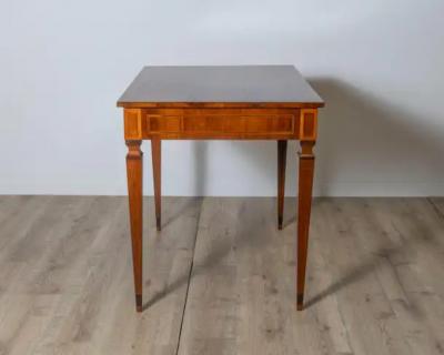 A very elegant walnut table desk with a central drawer