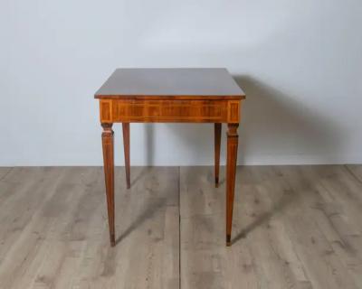 A very elegant walnut table desk with a central drawer