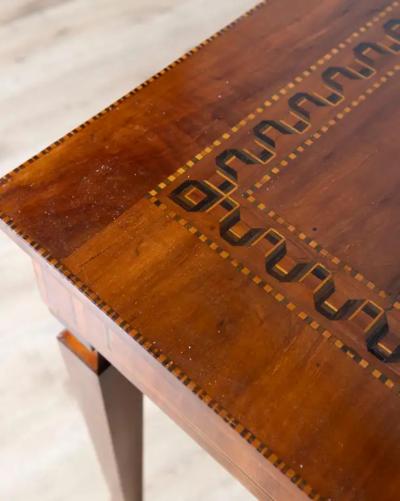 A very elegant walnut table desk with a central drawer