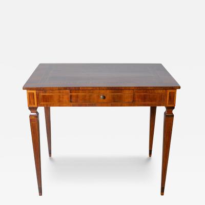 A very elegant walnut table desk with a central drawer