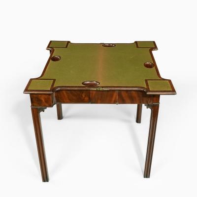 A very fine pair of George III mahogany concertina action card tables