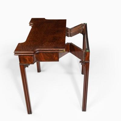 A very fine pair of George III mahogany concertina action card tables