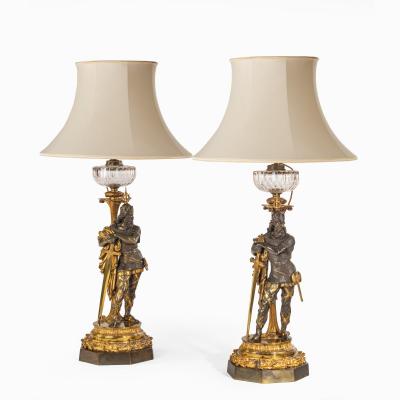 A very fine pair of mid Victorian parcel gilt bronze oil lamps by Hinks