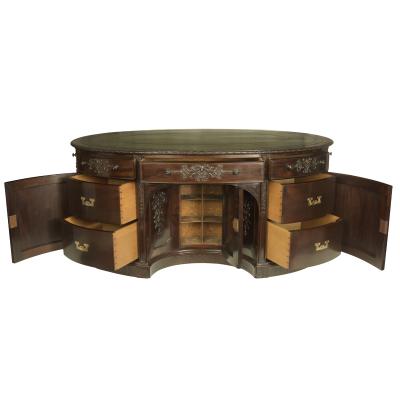 A very large mahogany centrepiece partners desk in the Chippendale style