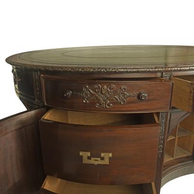 A very large mahogany centrepiece partners desk in the Chippendale style