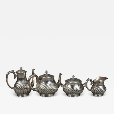 AN ANTIQUE 4 PIECE SILVER PLATED TEA SET BY CHRISTOFLE