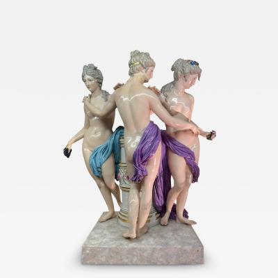 AN ANTIQUE MEISSEN PORCELAIN FIGURAL GROUP DEPICTING THE THREE GRACES