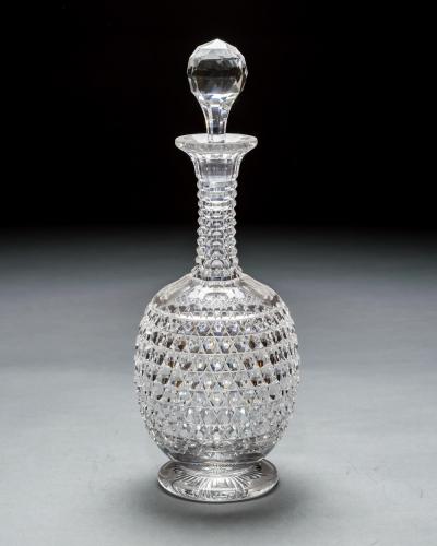 AN ELABORATELY CUT SUITE OF DECANTERS