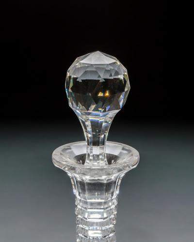 AN ELABORATELY CUT SUITE OF DECANTERS