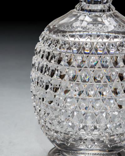 AN ELABORATELY CUT SUITE OF DECANTERS