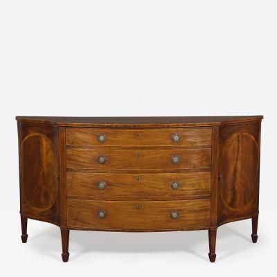 AN ELEGANT GEORGE III MAHOGANY AND BOXWOOD INLAID COMMODE OF RARE FORM