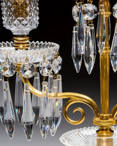 AN ELEGANT PAIR OF ORMOLU GLASS REGENCY CANDELABRA
