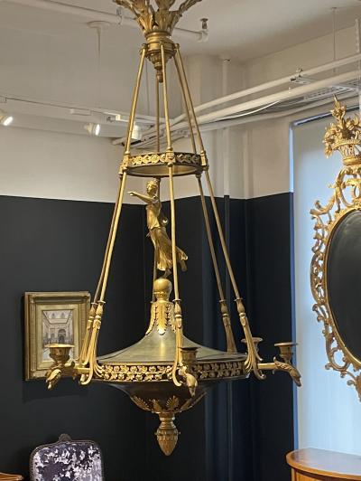 AN EMPIRE STYLE ORMOLU SIX LIGHT CHANDELIER