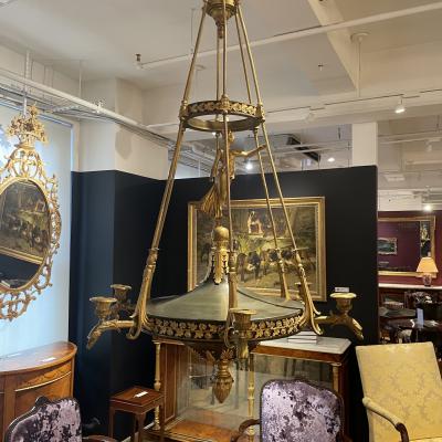 AN EMPIRE STYLE ORMOLU SIX LIGHT CHANDELIER