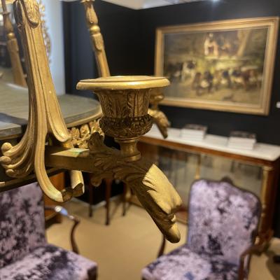 AN EMPIRE STYLE ORMOLU SIX LIGHT CHANDELIER