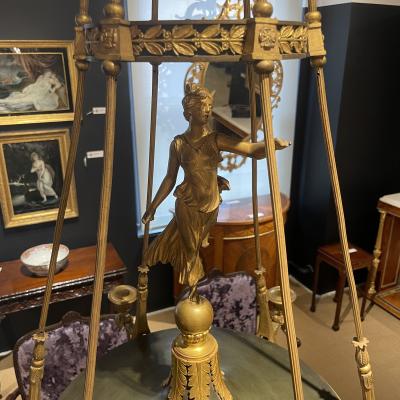 AN EMPIRE STYLE ORMOLU SIX LIGHT CHANDELIER