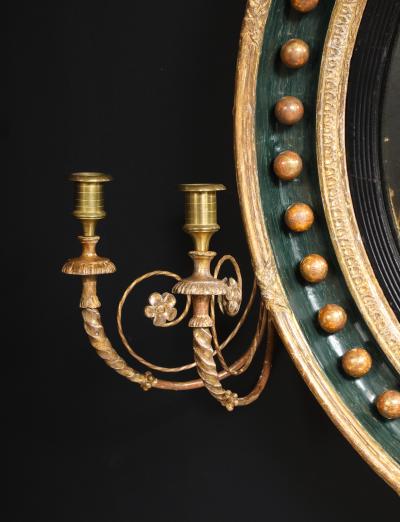 AN ENGLISH REGENCY GILTWOOD CONVEX MIRROR