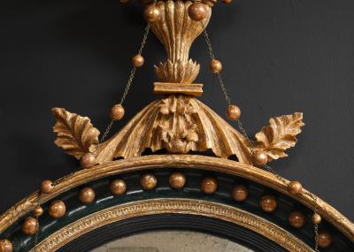 AN ENGLISH REGENCY GILTWOOD CONVEX MIRROR