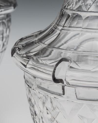 AN EXCEPTIONAL PAIR OF GEORGE III CUT GLASS URNS COVERS