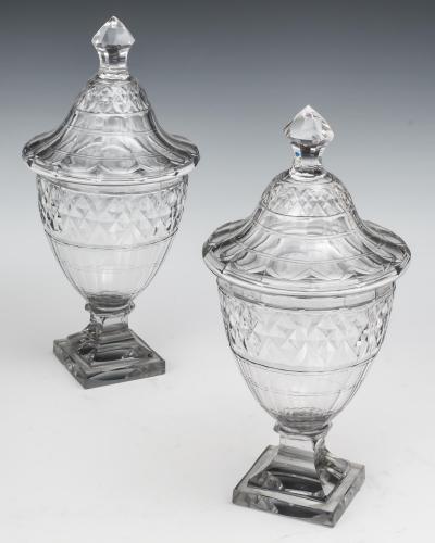 AN EXCEPTIONAL PAIR OF GEORGE III CUT GLASS URNS COVERS