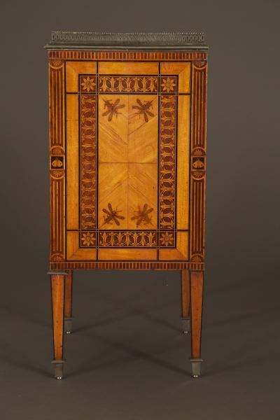 AN EXQUISITE PAIR OF NEOCLASSICAL MARQUETRY AND STEEL MOUNTED PETIT COMMODES