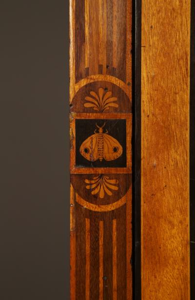 AN EXQUISITE PAIR OF NEOCLASSICAL MARQUETRY AND STEEL MOUNTED PETIT COMMODES