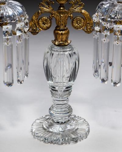 AN EXQUISITE PAIR OF REGENCY CUT GLASS GILT BRONZE CANDELABRA