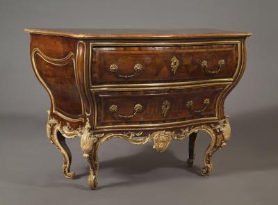 AN EXTRAORDINARY WALNUT AND EXOTIC WOODS INLAID PARCEL GILT COMMODE