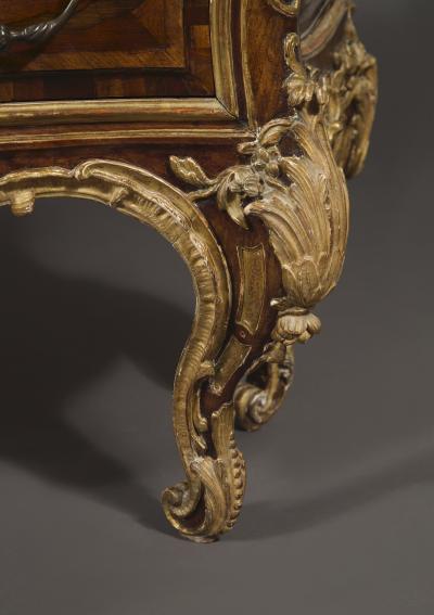 AN EXTRAORDINARY WALNUT AND EXOTIC WOODS INLAID PARCEL GILT COMMODE