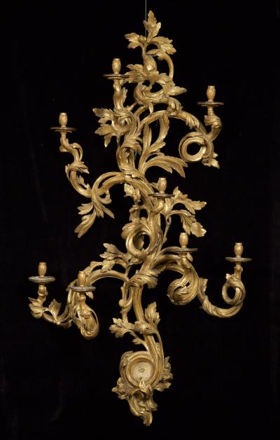 AN IMPORTANT PAIR OF ROCOCO GILTWOOD GIRANDOLES OF MASSIVE SCALE