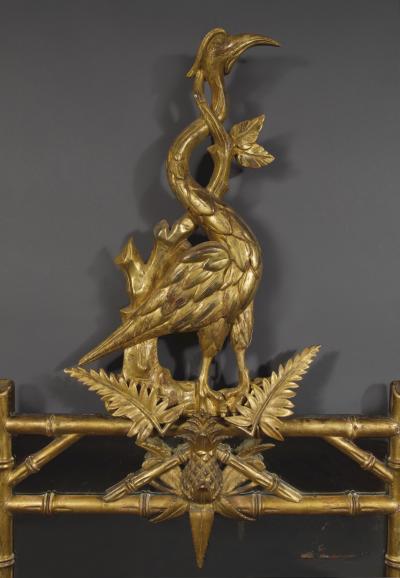 AN INTERESTING LATE REGENCY CARVED GILTWOOD MIRROR SURMOUNTED BY A CARVED HERON