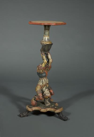 AN INTERESTING PAIR OF CARVED AND POLYCHROME PAINTED STANDS