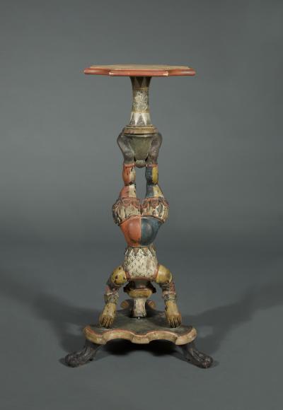 AN INTERESTING PAIR OF CARVED AND POLYCHROME PAINTED STANDS