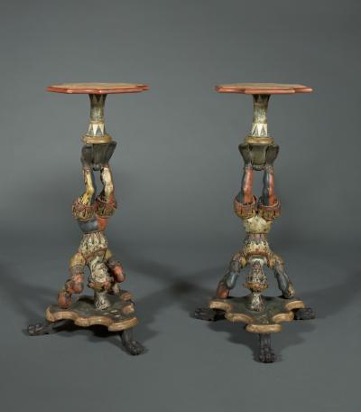 AN INTERESTING PAIR OF CARVED AND POLYCHROME PAINTED STANDS