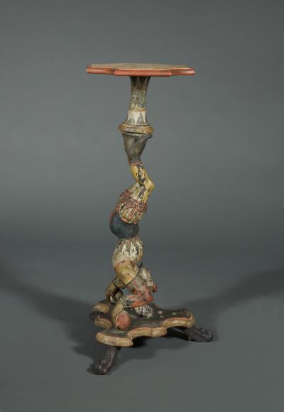 AN INTERESTING PAIR OF CARVED AND POLYCHROME PAINTED STANDS