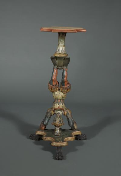 AN INTERESTING PAIR OF CARVED AND POLYCHROME PAINTED STANDS