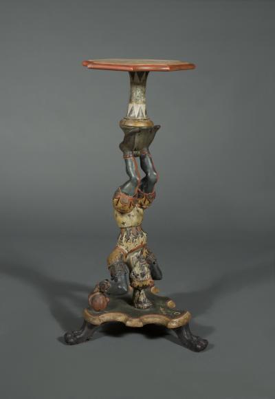 AN INTERESTING PAIR OF CARVED AND POLYCHROME PAINTED STANDS