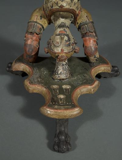 AN INTERESTING PAIR OF CARVED AND POLYCHROME PAINTED STANDS